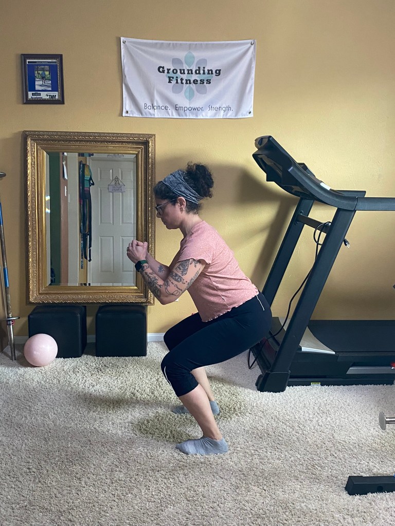 Carola doing a bodyweight squat