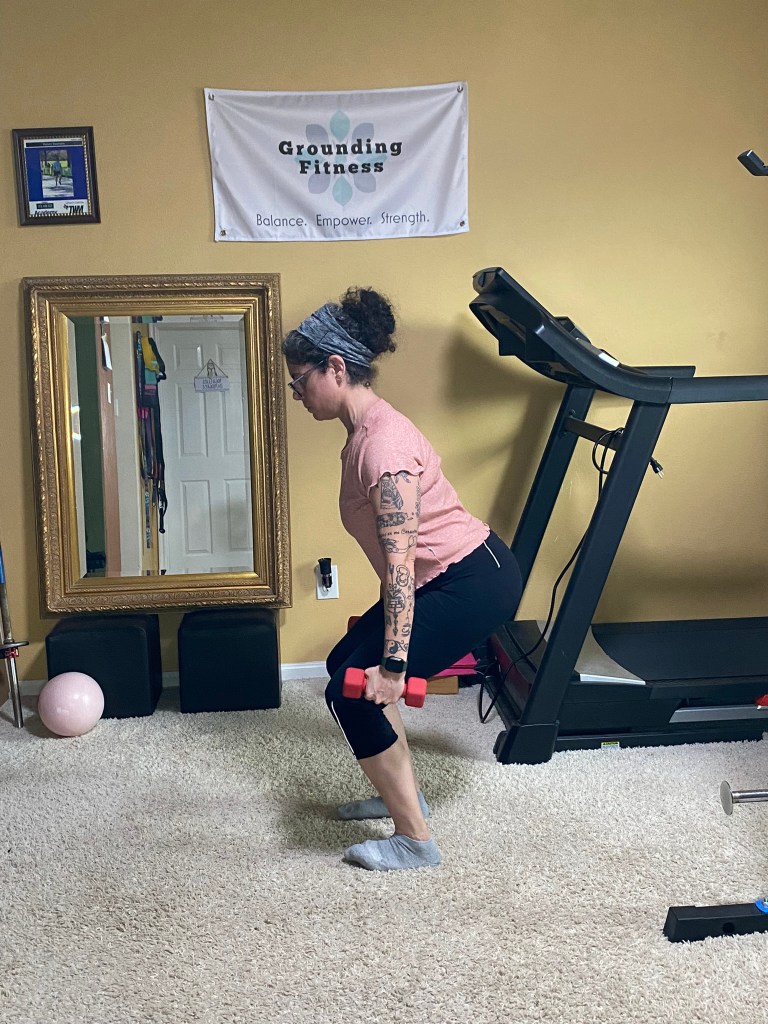 Carola performing squat with weights